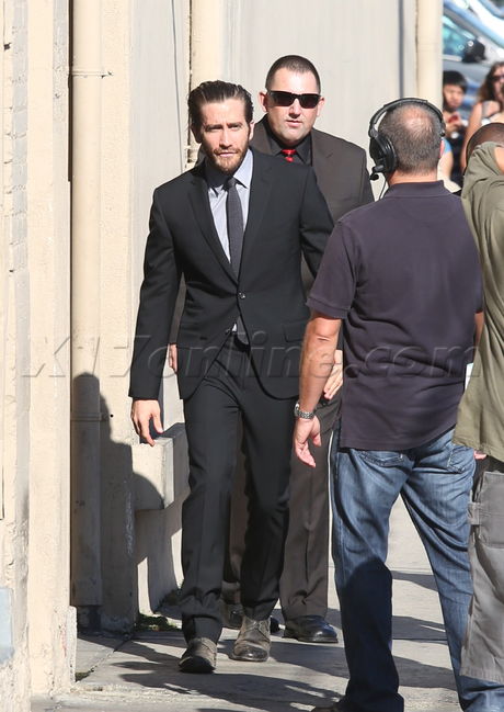 tv show interview Jake Gyllenhaal slick hair suit beard 
