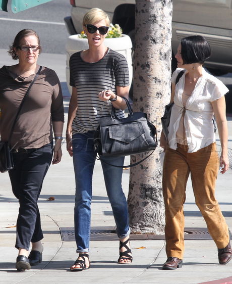 Charlize Theron scar jeans sunglasses cafe med stripes 