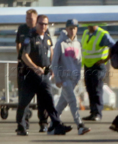 Justin Bieber lax private jet singer customs police hat hoody