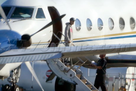 Justin Bieber lax private jet singer customs police hat hoody 