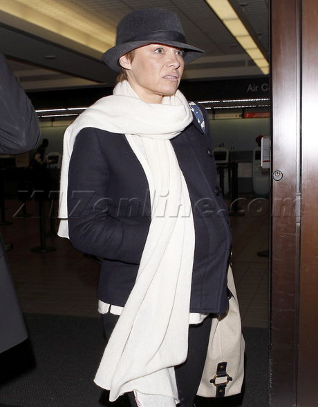Pamela Anderson scarf pixie boots fashion baywatch lax airport