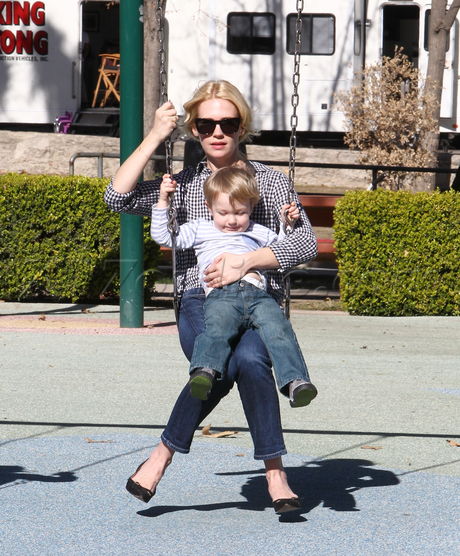 January Jones blonde sungalsses park playground los feliz stripes swing set happy