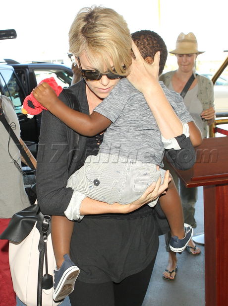 Charlize Theron sunglasses jackson sandals