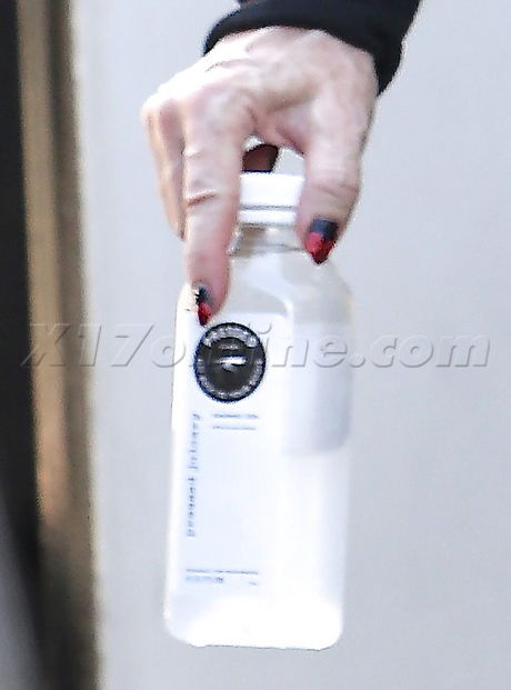 Madonna sweats pilates pressed juice hat sunglasses