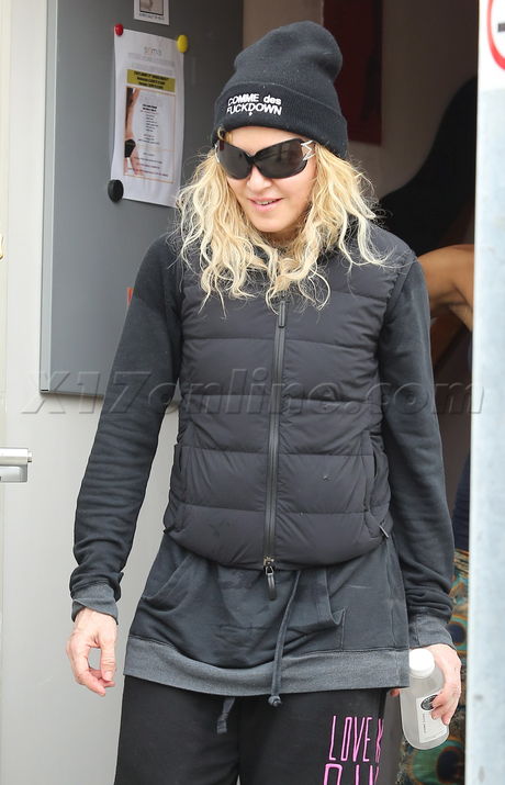 Madonna sweats pilates hat sunglasses