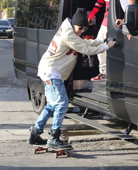 Justin Bieber Four Seasons Beverly Hills skate-hitching skitching 