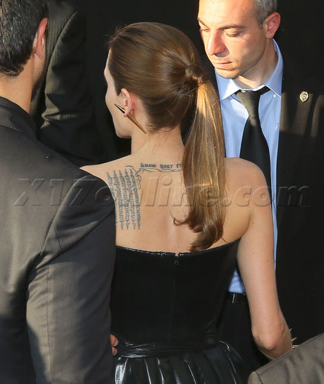 Angelina Jolie and Brad Pitt Premiere Maleficent black gown suit
