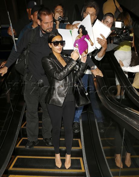 sunglasses Kim Kardashian leather blazer black clothes heels autographs 